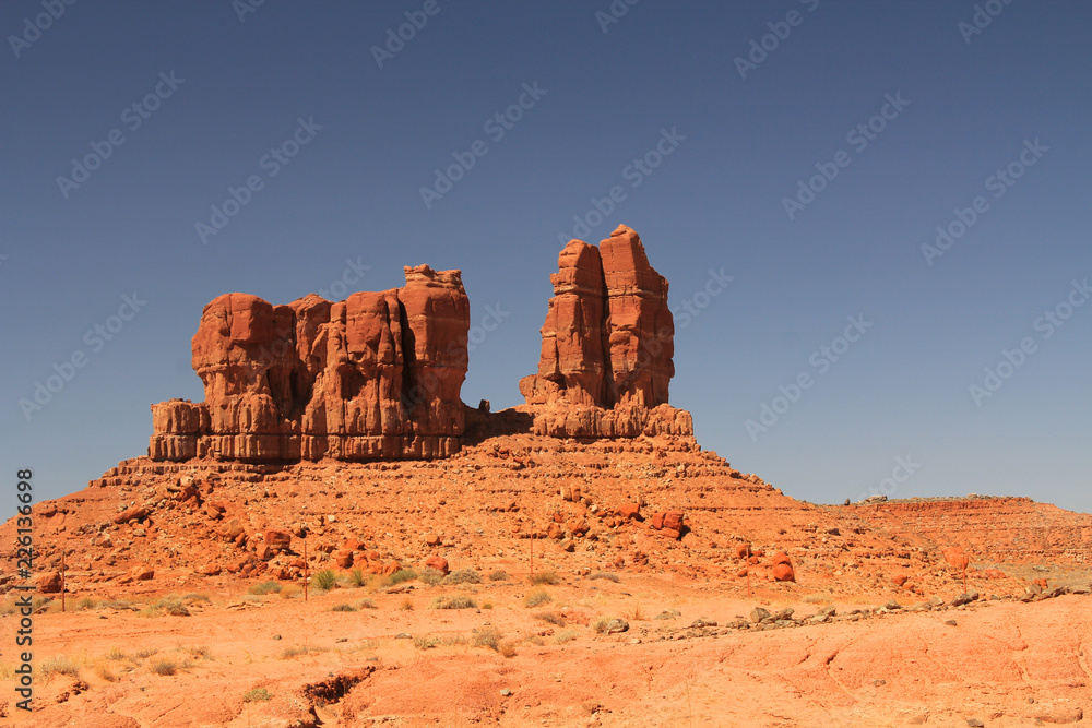 Red rock formation on the Navajo Indian Reservation near Shiprock in northern New Mexico with blue sky and rocky copy space. 