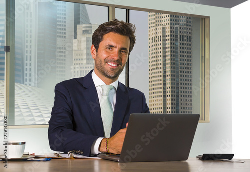 Photography young happy and attractive successful businessman working at modern office in ce