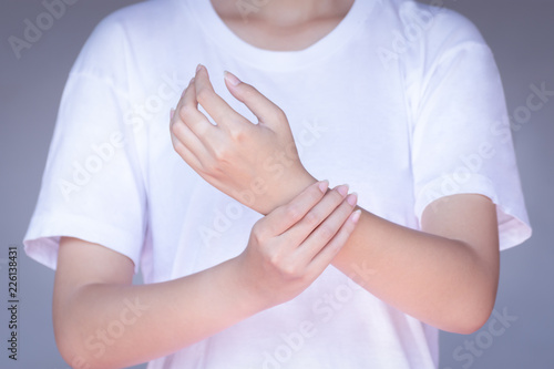 Wallpaper Mural young woman pain in wrist from working Torontodigital.ca