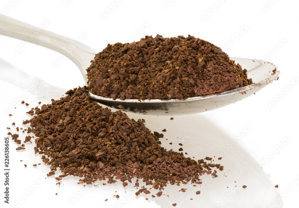spoon of coffee grounds with white background spoon of coffee grounds with white background