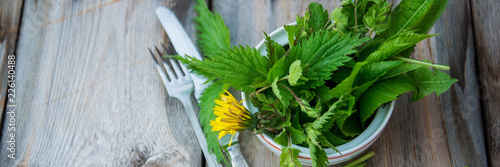 Close up salad leaves garden herbs and edible flowers. Healthy nutrition. Food background