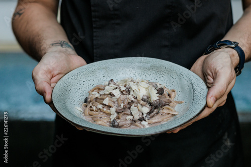 hand holding truffle pasta