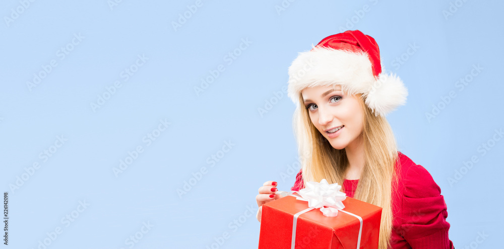 Young and beautiful girl in a Christmas hat. Winter concept. Young and beautiful girl in a Christmas hat. Winter concept.