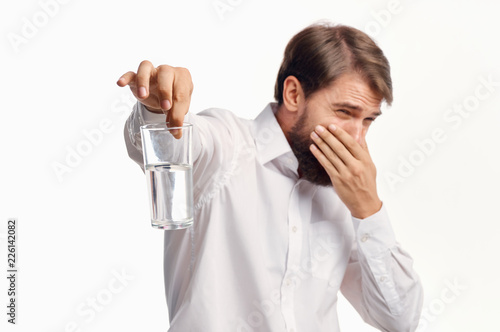 the man covered his nose with his hand the water in the glass stinks