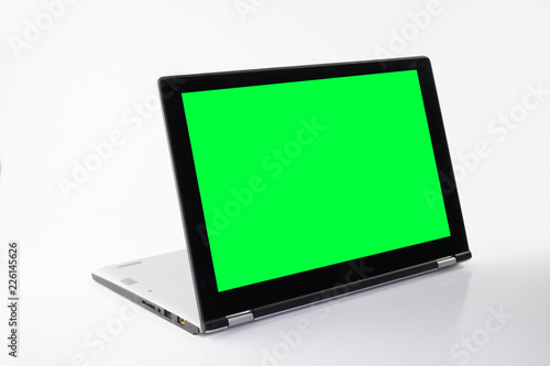 Laptop or notebook with chroma green display on a isolated background © HEMINXYLAN