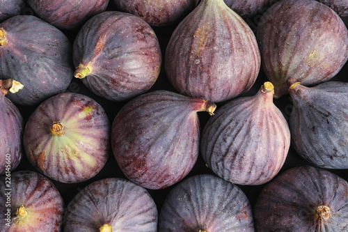 Many whole fresh purple figs as background, top view © New Africa
