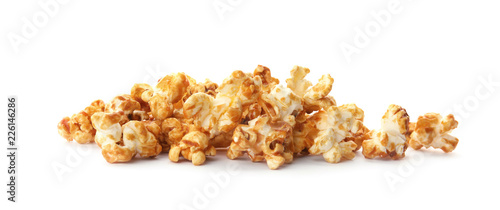 Pile of delicious caramel popcorn on white background