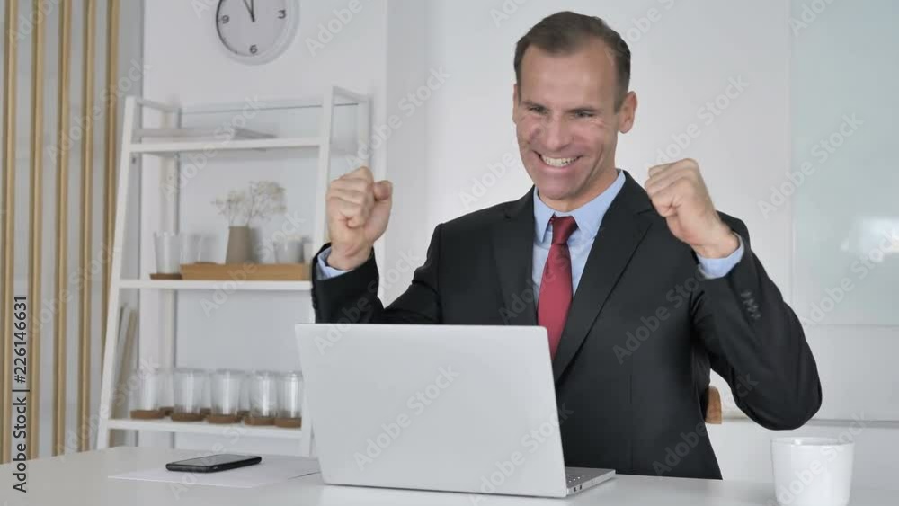 Middle Aged Businessman Celebrating Success of Project Middle Aged Businessman Celebrating Success of Project