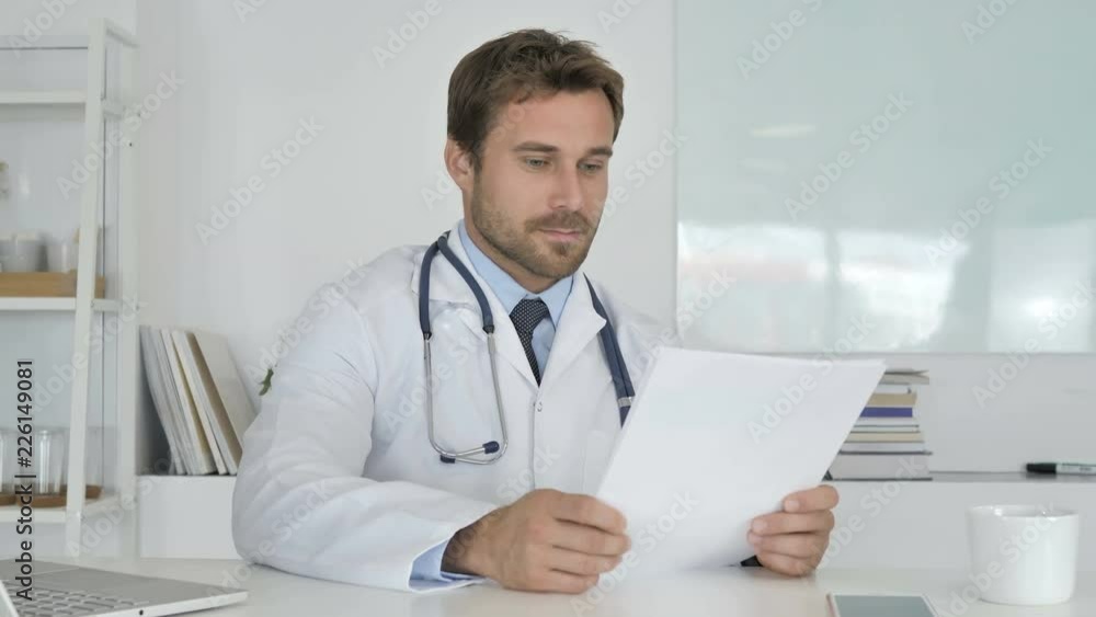 Doctor Reading Documents in Clinic, Paperwork Doctor Reading Documents in Clinic, Paperwork