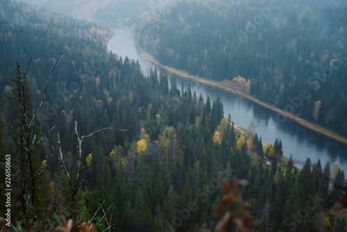 Misty landscape with soft: top view of the river in the autumn forest