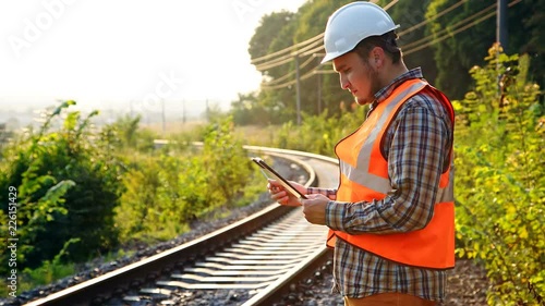 An engineer on a railway explores and records the state of the tracks