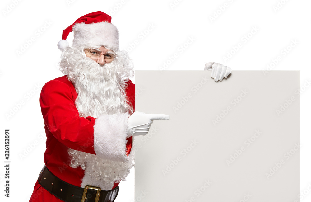 Happy Santa Claus points to a blank banner with to copy space. Happy Santa Claus points to a blank banner with to copy space.