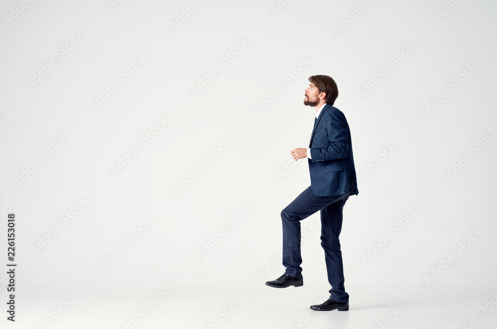 business man with a beard in profile goes on an isolated background business man with a beard in profile goes on an isolated background