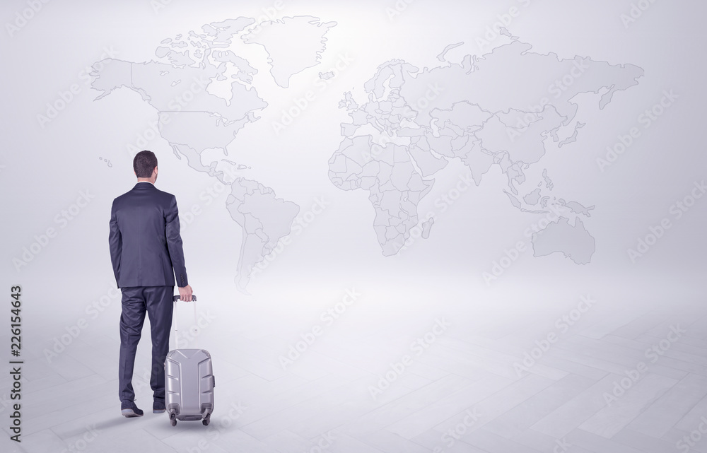 Businessman in dark suit planning his trip in a front of a map
Businessman in dark suit planning his trip in a front of a map