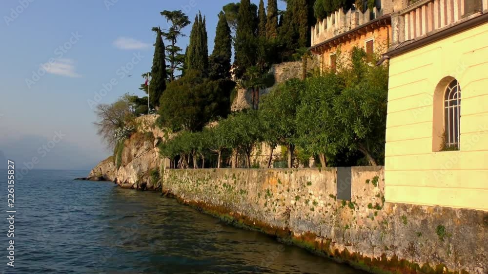 Buildings of Malcesine on April 20, 2015, in Malcesine, at Lake Garda, Trentino, Italy. Lake Garda is a popular holiday location in northern Italy. Buildings of Malcesine on April 20, 2015, in Malcesine, at Lake Garda, Trentino, Italy. Lake Garda is a popular holiday location in northern Italy.