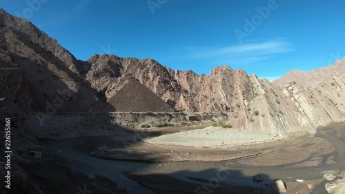 Troya Canyon and Desaguadero RIver in Vinchina town. Mountains, valleys at midday. 4x4 adventure excursion. La Rioja province, Argentina. Camera panning, left to right panoramic view photo