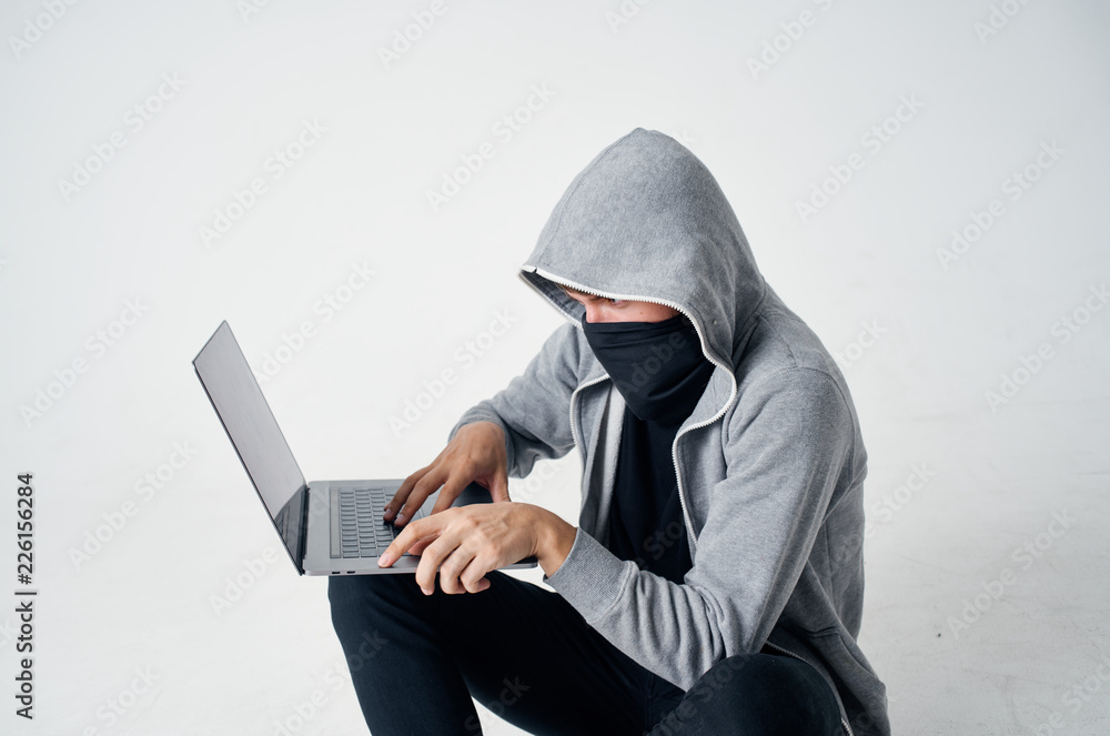 hacker man hacks laptop hacker man hacks laptop