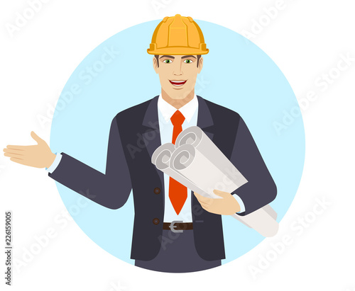 Businessman in construction helmet holding the project plans and showing something beside of him