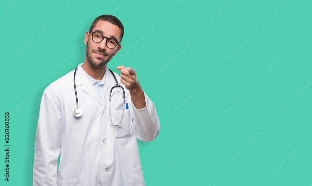 Confident young doctor pointing at you Confident young doctor pointing at you