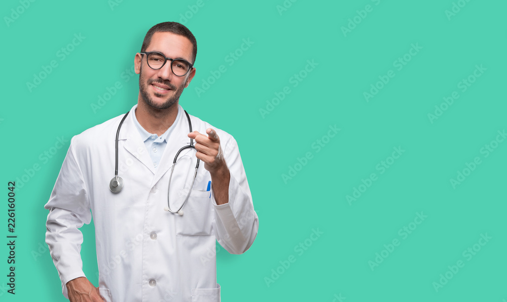 Confident young doctor pointing at you Confident young doctor pointing at you