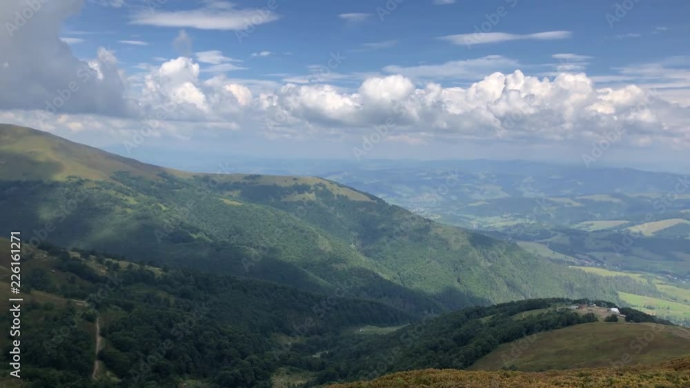 Beautiful mountain landscape from the top of the mountain on a summer day. The sky with beautiful clouds. Beautiful mountain landscape from the top of the mountain on a summer day. The sky with beautiful clouds.