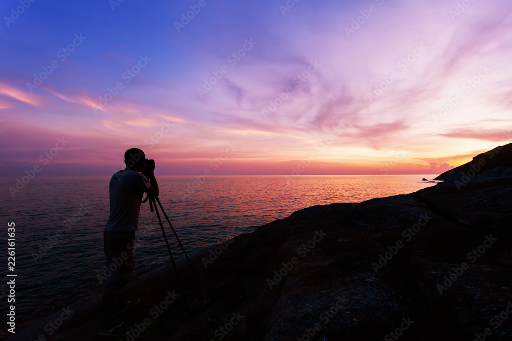 Professional photography on the stones in sunset or sunrise dramatic sky over the tropical sea in phuket thailand