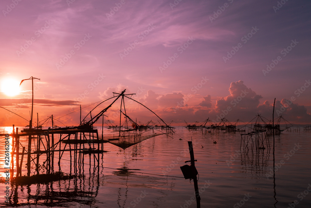 sunrise with fishing trap in pak pra village, Phatthalung Thailand.