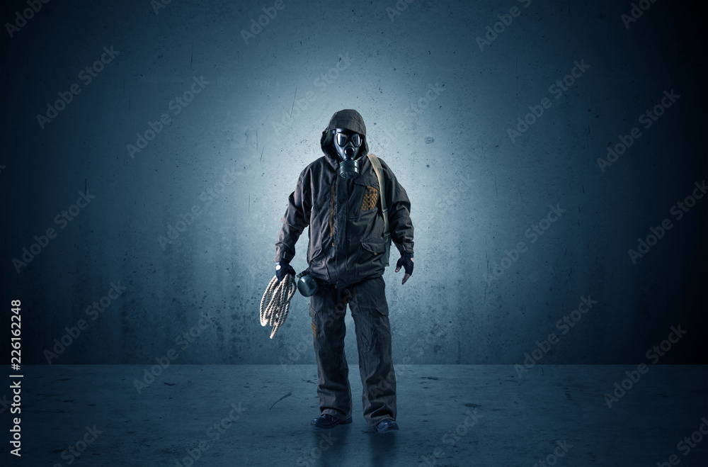 Bad agent in a dark room with arms on his hand and gas mask
Bad agent in a dark room with arms on his hand and gas mask