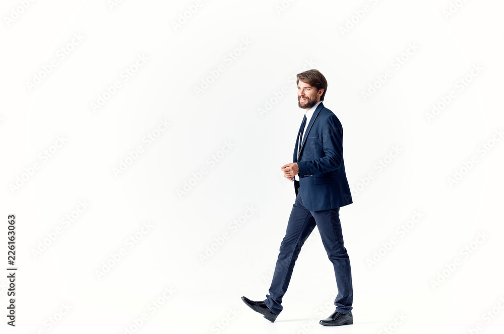 business man with a beard in full growth goes on an isolated background business man with a beard in full growth goes on an isolated background