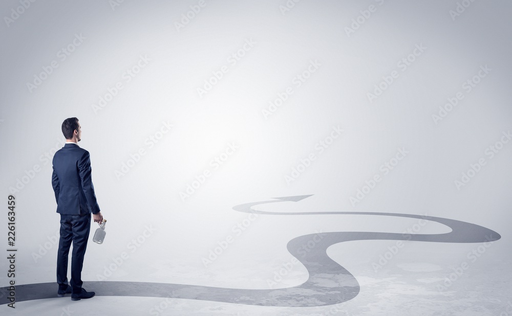 Man with object in his hand on the direct way to success Man with object in his hand on the direct way to success