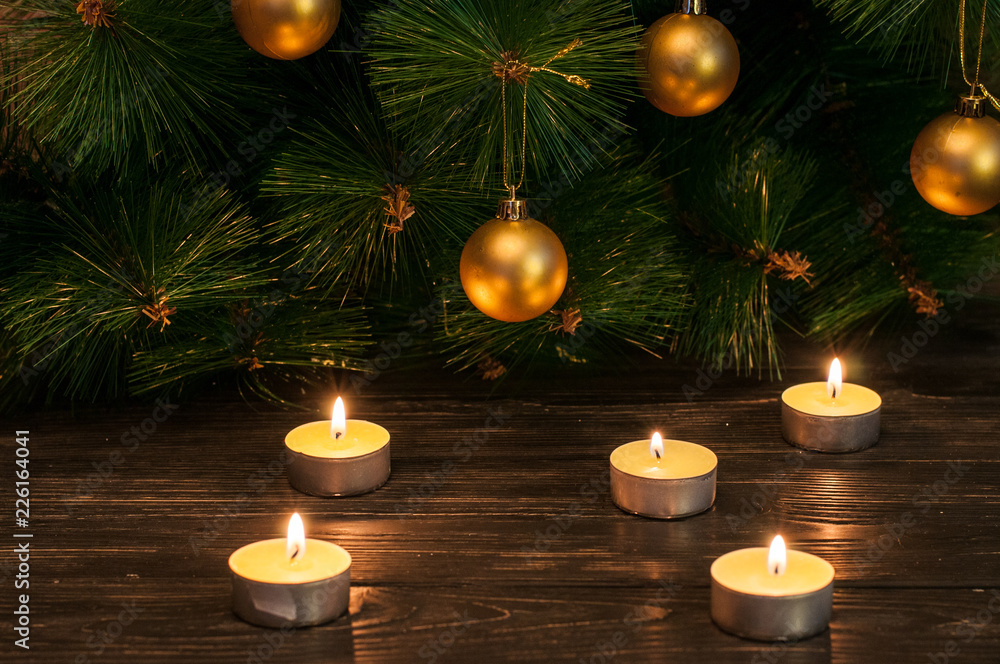Christmas candles under the tree