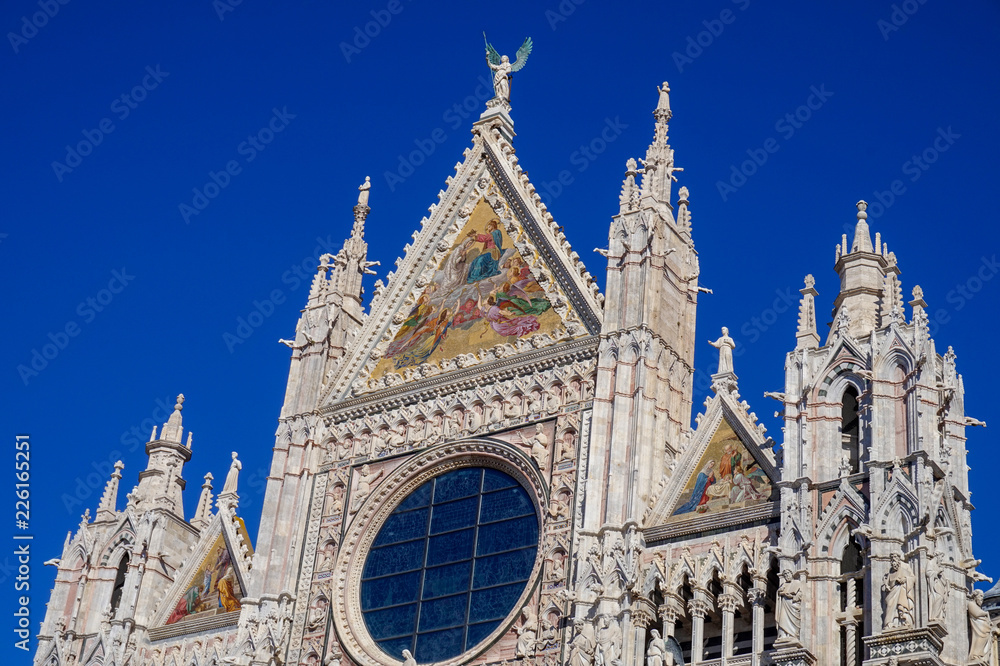 Upper facade mosaic above Siena cathedral