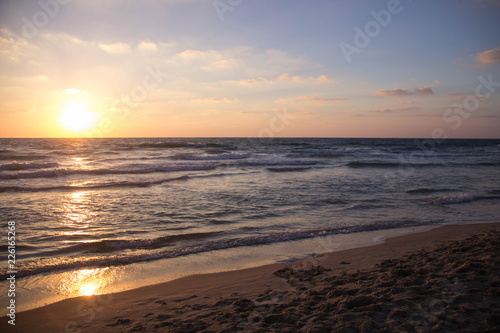 Beautiful bright sunset on the sea coast