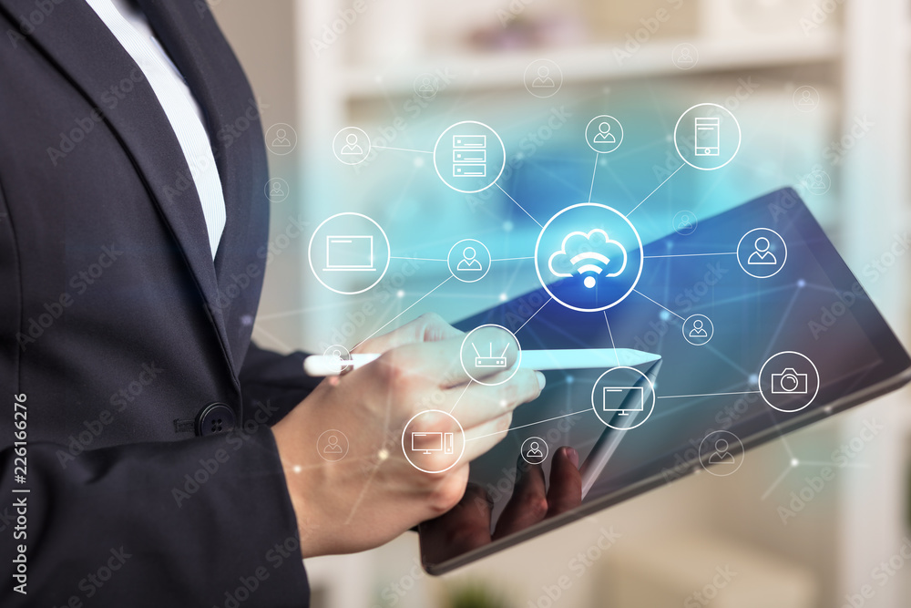 Business woman using tablet with network security and online storage system concept
Business woman using tablet with network security and online storage system concept