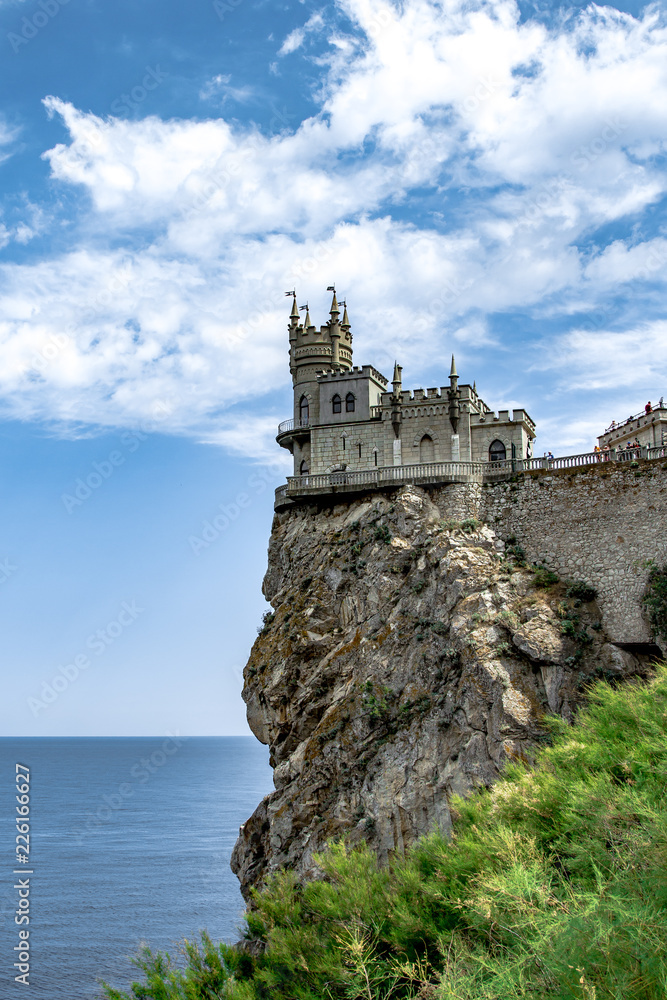 Scenic panoramic view of Crimea southern coast. Amazing castle Swallow's Nest on a cliff at the Black Sea, Crimea