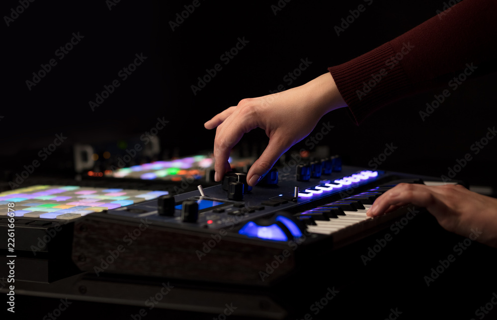 Dj hand remixing music on midi controller
Dj hand remixing music on midi controller