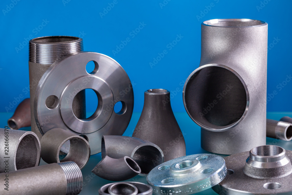 Set of steel welding fittings like tees, elbows, flanges, reducers, sockets, nipples, cups and others.