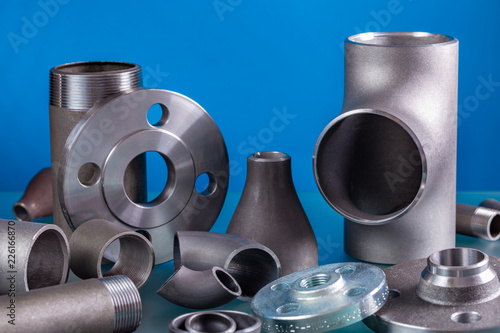 Obraz na płótnie Set of steel welding fittings like tees, elbows, flanges, reducers, sockets, nipples, cups and others. w salonie