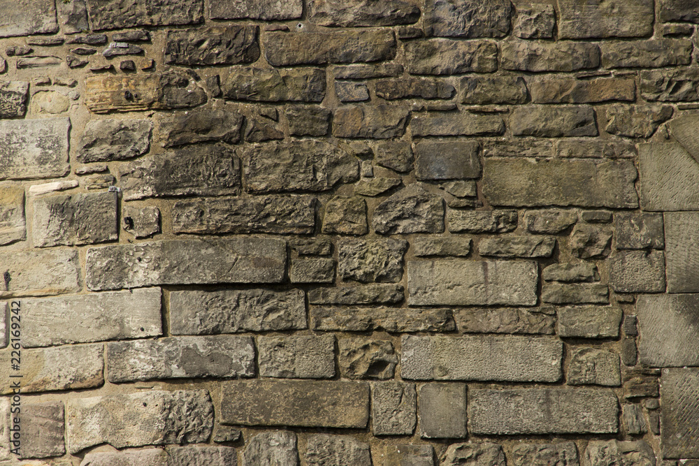 Hintergrund von Steinwand gemischter Steingröße von Burgwand Stock-Foto |  Adobe Stock