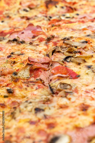 Cutted pizza as food background. Close up.