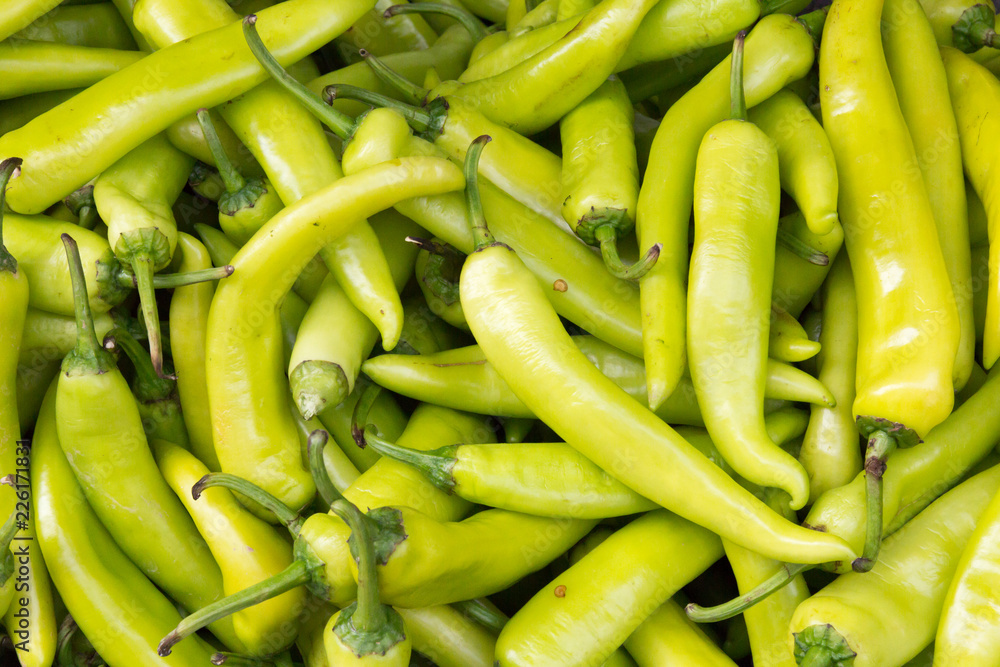 Green chilli peppers on market stall Green chilli peppers on market stall