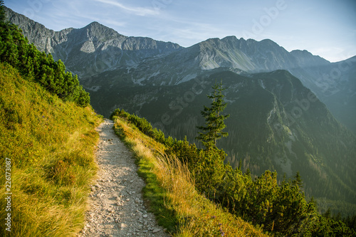 Fototapeta Naklejka Na Ścianę i Meble -  A beautiful hiking trail in the mountains. Mountain landscape in Tatry, Slovakia. Walking path scenery.
