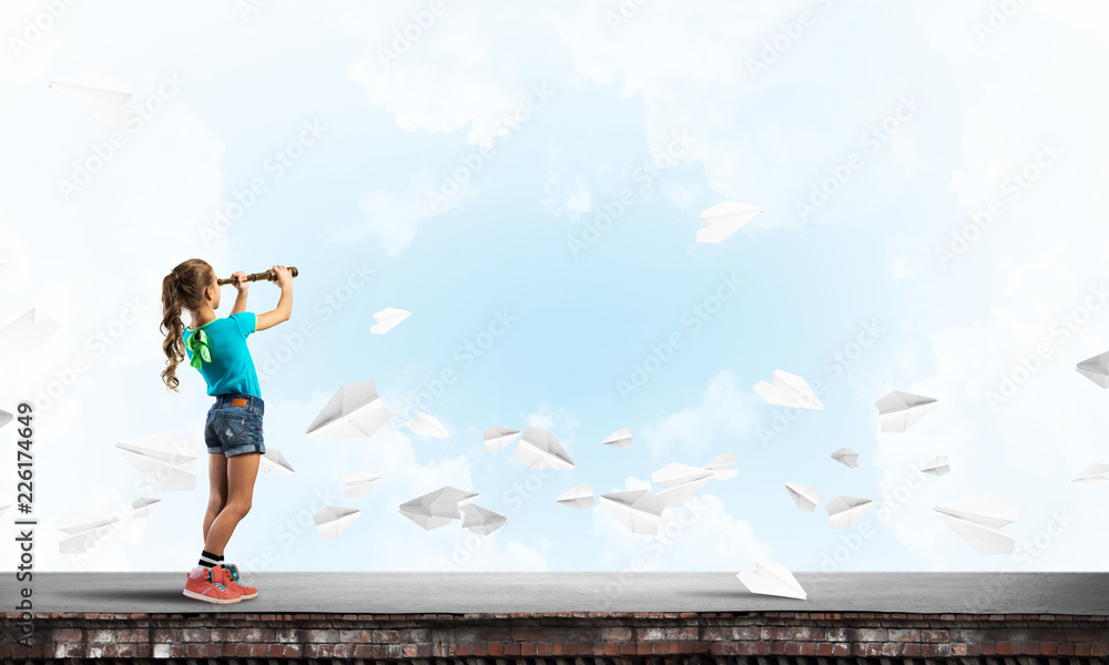 Concept of careless happy childhood with girl exploring this world Concept of careless happy childhood with girl exploring this world