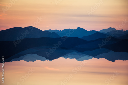 Fototapeta Naklejka Na Ścianę i Meble -  Colorful, abstract double exposure of mountains in sunrise. Minimalist scenery with color gradients. Tatra mountains in Slovakia, Europe.