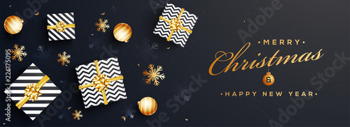 Top view of Merry Christmas and Happy New Year website banner design with gift boxes and stars and space for your product image.