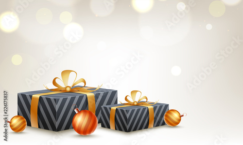 3D gift boxes and baubles on shiny blurred background with space for your text.