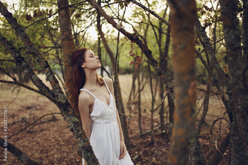woman by the tree in the village summer vacation woman by the tree in the village summer vacation
