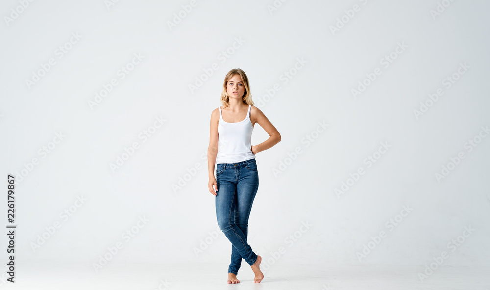 young woman in a white T-shirt jeans clothes