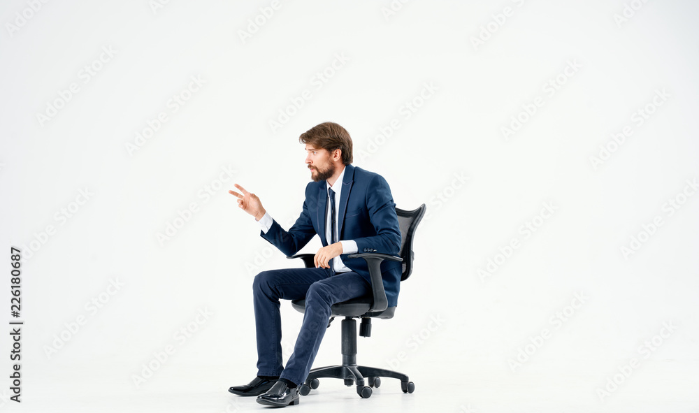 business man sitting on a chair on an isolated background business man sitting on a chair on an isolated background