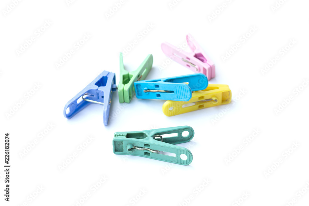 Pile of colorful clothespins isolated on white background Pile of colorful clothespins isolated on white background